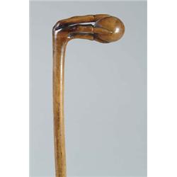 Lot #  618D.:  CANE: CARVED WOOD TALON AND BALL CANE.
