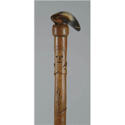 Lot #  634C.:  CANE: CARVED WOOD AND HORN CANE.
