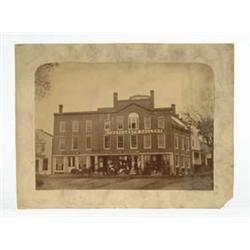 Lot #  647:  UNFRAMED EARLY PHOTO OF A NEW ENGLAND MERCHANT’S BLOCK.