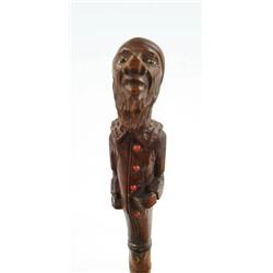 Lot #  707:  CANE:  CARVED MAN PIPE CANE.