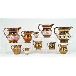Lot #  743:  LOT OF TEN COPPER LUSTRE PITCHERS.