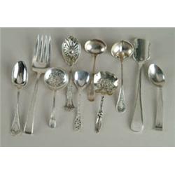 Lot #  858:  NINE PIECES OF STERLING FLATWARE.