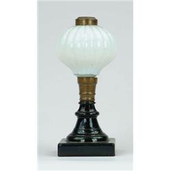 Lot #  1013:  MILK AND BLACK GLASS FLUID LAMP.