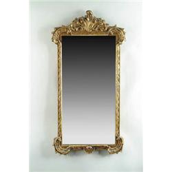 Lot #  1030:  CARVED WOOD AND GESSO DECORATED WALL MIRROR.