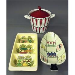 A sallad bowl , a serving dish and a tureen