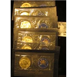 (1) 1973 S & (5) 74 S Silver Eisenhower Dollars in original blue packs of issue. All Gem BU.