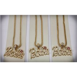 LOT OF THREE "BARBIE" PENDANTS ON CHAINS