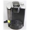Image 1 : BLACK & CHROME KEURIG COFFEE MACHINE -