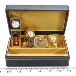 GROUP OF 4 MINIATURE BRASS CLOCKS