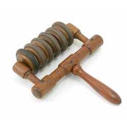 A late Victorian roller massager, beechwood frame and handle with patent stamp,...