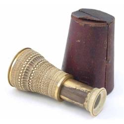 A Victorian carved ivory single draw eye glass, brass mounted lens and tube engraved with A. Abra...