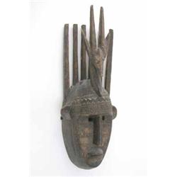 A Bambara M'tomo carved wood mask, with antelope and horn crest, 20 ins...