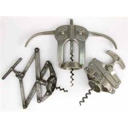 A 19th century 'Perfect' patent lever corkscrew, a 'Magic Lever' cork drawer and a further zig za...