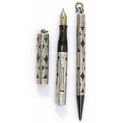 An early 20th century Waterman's Ideal silver filigree lady's fountain pen and pencil, black hard...