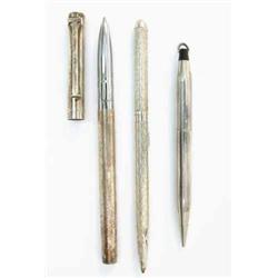 A Tiffany & Co silver 'T' clip ball point pen, with another Tiffany ball point pen and an America...