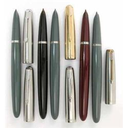 A set of five Parker 51 fountain pens, three finished in teal blue, one with a gold insignia cap...
