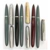 Image 1 : A set of five Parker 51 fountain pens, three finished in teal blue, one with a gold insignia cap...