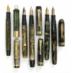 A Conklin lever fill fountain pen, gold and black marble finish with a two gold ring cap, and fou...