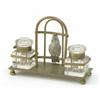 Image 1 : A Victorian brass inkwell stand, with a model of a caged parrot between a pair of cut glass inkwe...