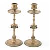 Image 1 : A pair of Victorian gothic design copper candlesticks, with red glass mounted knops on column ste...
