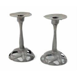 A pair of Art Nouveau pewter candlesticks, in the form of a flower and stem, on pierced dome base...