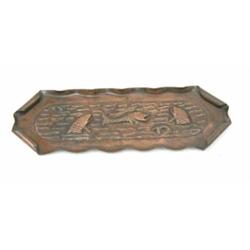 An embossed copper pen tray, decorated with diving fish and scrolled edges, 11ins...