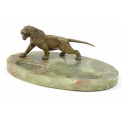 An Asprey green onyx oval desk stand, mounted with a brass figure of a snarling tiger, 9.5ins...