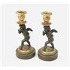 Image 1 : A pair of early 19th century French bronze and gilt candlesticks, on cupid figure supports with v...