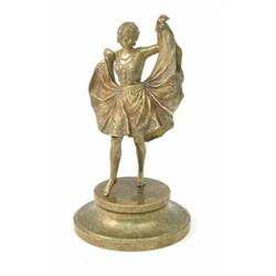 A Bergmann Austrian novelty brass figure of a female dancer, modelled with a rising dress reveali...