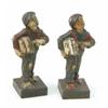 Image 1 : Two 'Spheshul' cold painted figures of an urchin newspaper seller, one with green, the other with...