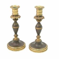 A pair of Regency brass candlesticks, on bronzed baluster stems with acanthus decorated sconces,...