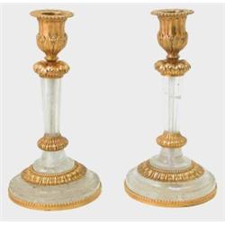 A pair of Louis XV design rock crystal and ormolu candlesticks, on reeded stems with acanthus lea...