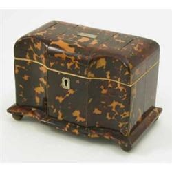 A George III tortoiseshell tea caddy, with concave sections to front, two covered canisters enclo...