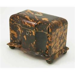 A George III tortoiseshell tea caddy, with concave sections to front, two covered canisters enclo...