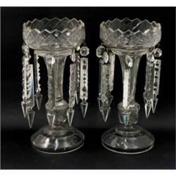 A pair of Victorian clear glass table lustres, with cut lustre drops, on hollow stems and domed b...