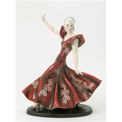 A Goldscheider figure of a dancer modelled by Claire Weiss, female in long evening dress painted...