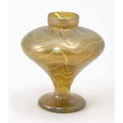 A Loetz-type glass vase, of inverted baluster shape with wavy bands against a gold iridescent gro...