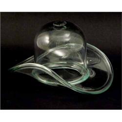 A mid-19th century Nailsea bottle-green glass frigger, in the form of a bowler hat with upturned...