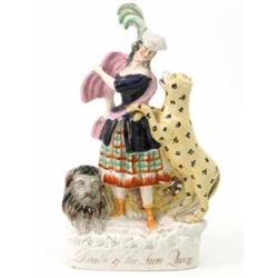 A Victorian Staffordshire pottery portrait group, "Death of the Lion Queen", female figure with r...