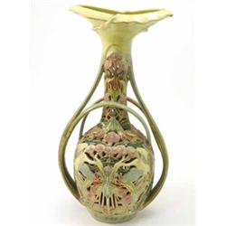 An E. Fischer, Budapest faience vase, with sinuous stalk handles, the baluster body pierced and m...