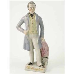 A Victorian Staffordshire pottery figure, "Wellington", standing, wearing three-quarter length bl...