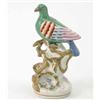 Image 1 : A Victorian Staffordshire pottery model of a bird, painted in bright colours, perched upon branch...
