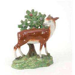 An early 19th century Staffordshire pottery model of a deer, attributed to Walton, with bocage to...