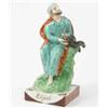 Image 1 : An early 19th century Staffordshire figure, "Elijah", seated prophet feeding raven, on square, ti...