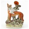 Image 1 : A Victorian Staffordshire spill vase group, fox and bird of prey, on moulded base, 9.25in....