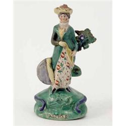 A late 18th century Staffordshire figure, "Archar", female figure with bow, arrow and quiver, on...