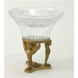 A French Empire design cut glass comport, supported on three ormolu caryatids and a triform base,...