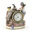 Image 1 : A late 19th century Naples porcelain timepiece, modelled in the form of a child grape-picker and...