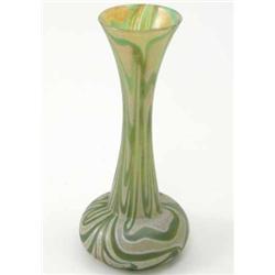 A Loetz-style glass vase, with continuous swirl effects in a green iridescence, 11in....