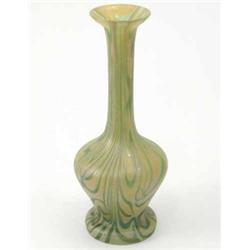 A Loetz-style glass vase with continuous swirl effects in a green iridescence, 11in....